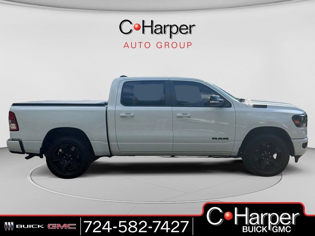 2022 RAM 1500 Big Horn Crew Cab 4x4 5'7" Box in White — front three-quarter view