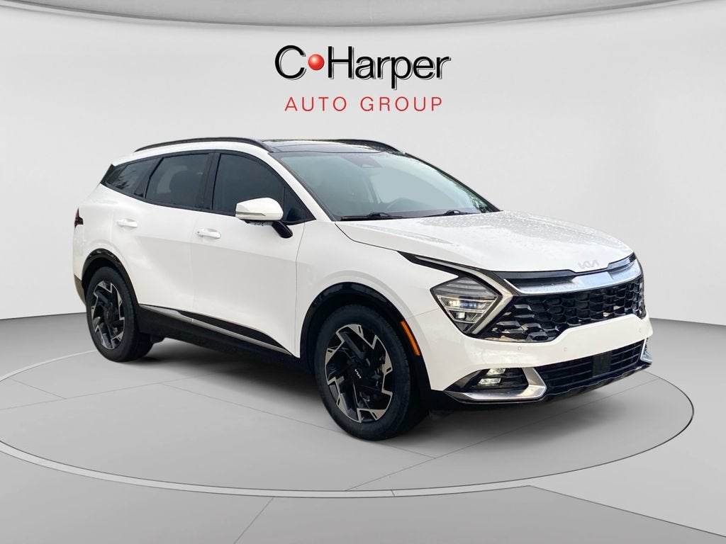 2023 Kia Sportage SX-Prestige in White — front three-quarter view